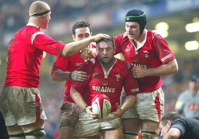 20.11.04...Wales v New Zealand, Millennium Stadium, Cardiff  Wales' try scorer Mefin Davies is congratulated by Brent Cockbain, Stephen Jones and Michael Owen  