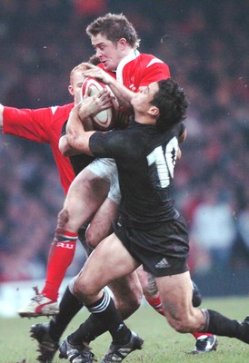 20-11-04. Wales v New Zealand   Wales' Rhys Williams is caught by Daniel Carter.  