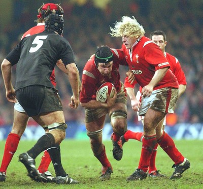 20.11.04  Wales v New Zealand, Cardiff  Wales Michael Owen finds a gap.  