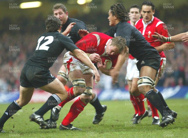 20.11.04...Wales v New Zealand, Millennium Stadium, Cardiff  Wales' Dafydd Jones charges into the All Blacks defence  