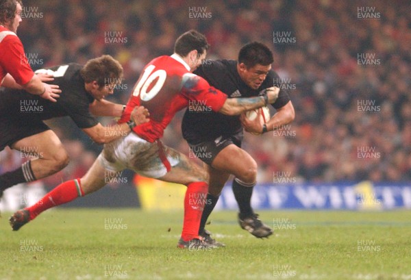 20.11.04 - Wales v New Zealand New Zealand's Kevin Mealamu tries to get through a Stephen Jones tackle  