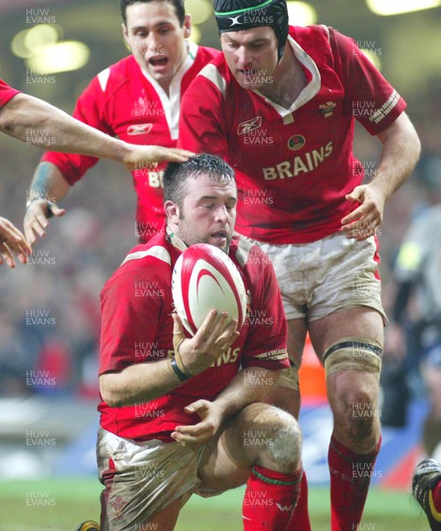 20.11.04...Wales v New Zealand, Millennium Stadium, Cardiff  Wales' try scorer Mefin Davies is congratulated Stephen Jones and Michael Owen   
