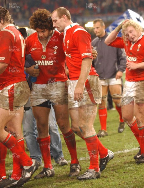 20-11-04. Wales v New Zealand   Wales' Colin Charvis and Gareth Thomas and Duncan Jones leave the field after being narrowly beaten by the All Blacks.  