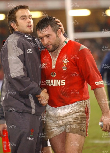 20-11-04. Wales v New Zealand   Wales' Rhys Williams consoles Mefin Davies as he leaves the field.  