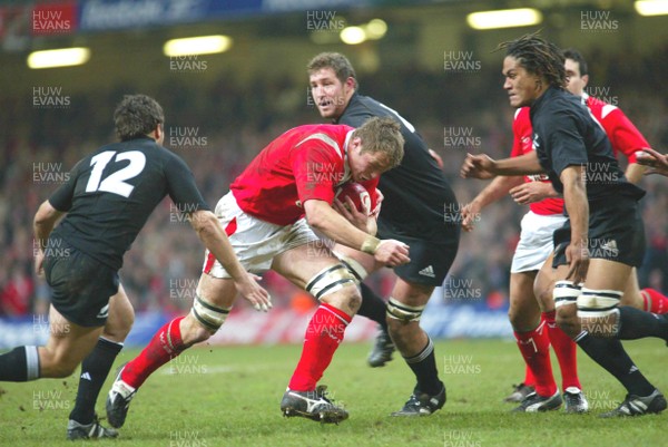 20.11.04...Wales v New Zealand, Millennium Stadium, Cardiff  Wales' Dafydd Jones charges into the All Blacks defence  