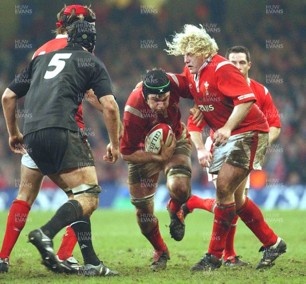 20.11.04  Wales v New Zealand, Cardiff  Wales Michael Owen finds a gap.  