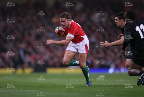 22.11.08 Wales v New Zealand... Wales' Lee Byrne gets past New Zealand's Dan Carter. 