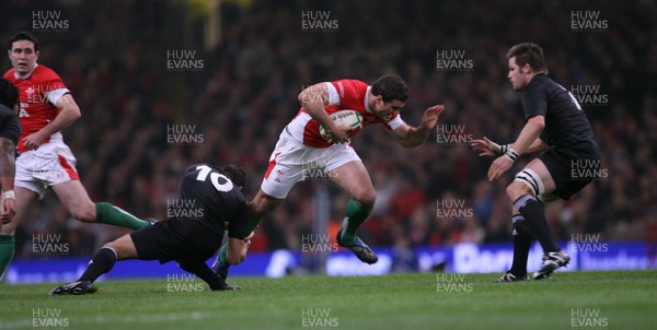 22.11.08 Wales v New Zealand... Wales' Jamie Roberts takes on New Zealand's Dan Carter. 