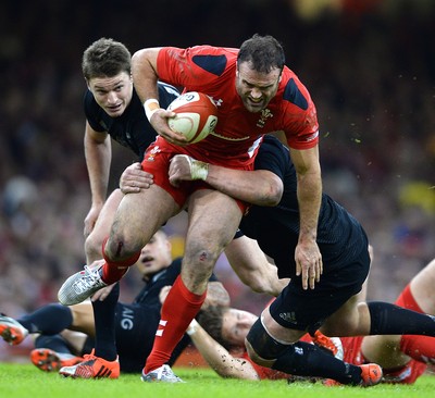 221114 - Wales v New Zealand All Blacks - Dove Men Care -Jamie Roberts of Wales is tackled by Wyatt Crockett of New Zealand