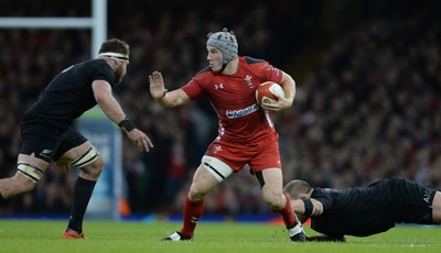 221114 - Wales v New Zealand All Blacks - Dove Men Care -Jonathan Davies of Wales is tackled by Kieran Read and Owen Franks of New Zealand