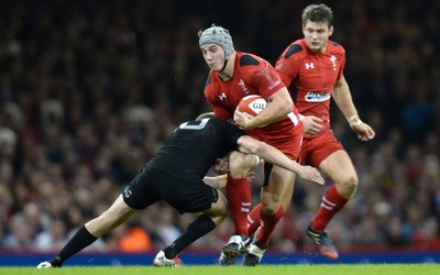 221114 - Wales v New Zealand All Blacks - Dove Men Care -Jonathan Davies of Wales is tackled by Beauden Barrett of New Zealand