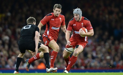 221114 - Wales v New Zealand All Blacks - Dove Men Care -Jonathan Davies of Wales is tackled by Beauden Barrett of New Zealand