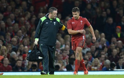 221114 - Wales v New Zealand All Blacks - Dove Men Care -Rhys Webb of Wales leave stye field with Doctor Geoff Davies