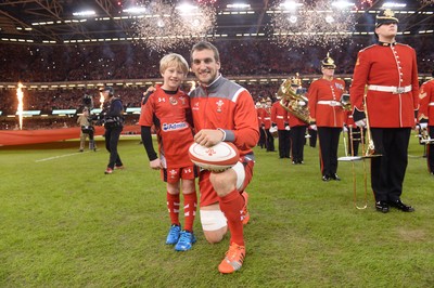 221114 - Wales v New Zealand All Blacks - Dove Men Care -Sam Warburton of Wales leads out his side with mascot