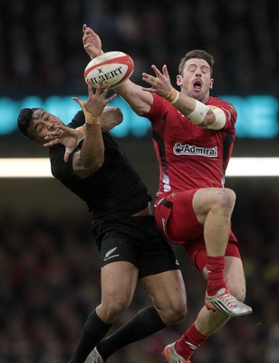 221114 - Wales v New Zealand - Dove Men Series 2014 - Julian Savea of New Zealand and Alex Cuthbert of Wales jump for the ball