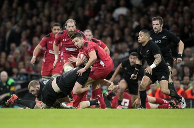 221114 - Wales v New Zealand - Dove Men Series 2014 - Rhys Webb of Wales is tackled by Brodie Retallick of New Zealand 