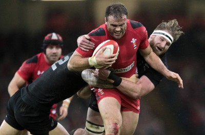 221114 - Wales v New Zealand - Dove Men Series 2014 - Jamie Roberts of Wales is tackled by Dane Coles and Kieran Read of New Zealand 