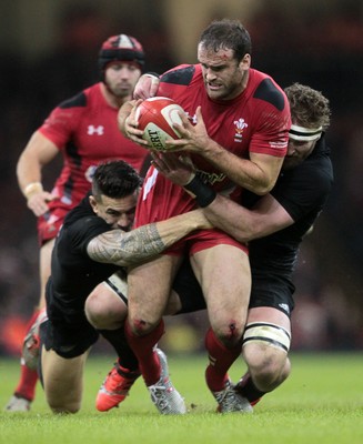 221114 - Wales v New Zealand - Dove Men Series 2014 - Jamie Roberts of Wales is tackled by Dane Coles and Kieran Read of New Zealand 