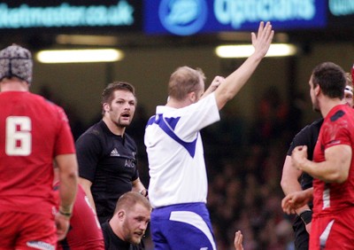 221114 - Wales v New Zealand - Dove Men+Care Series - Richie McCaw of New Zealand disagrees with the decision of referee Wayne BArnes