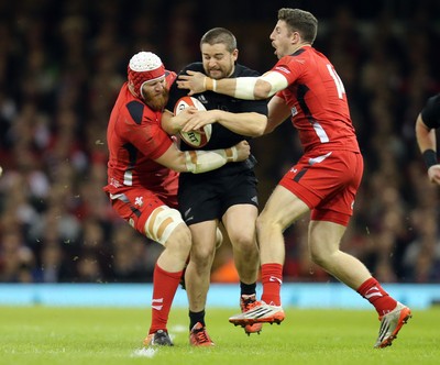 221114 -  Wales v New Zealand, Dove Men Series 2014, Cardiff - Dane Coles of New Zealand is tackled by Jake Ball of Wales and Alex Cuthbert of Wales 