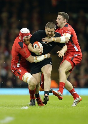 221114 -  Wales v New Zealand, Dove Men Series 2014, Cardiff - Dane Coles of New Zealand is tackled by Jake Ball of Wales and Alex Cuthbert of Wales 