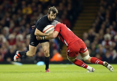 221114 -  Wales v New Zealand, Dove Men Series 2014, Cardiff - Conrad Smith of New Zealand is tackled by Dan Lydiate of Wales 