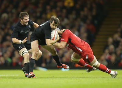 221114 -  Wales v New Zealand, Dove Men Series 2014, Cardiff - Conrad Smith of New Zealand is tackled by Dan Lydiate of Wales 