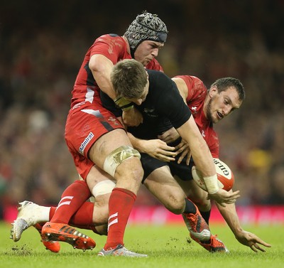 221114 -  Wales v New Zealand, Dove Men Series 2014, Cardiff - Beauden Barrett of New Zealand is tackle by Dan Lydiate of Wales and Sam Warburton of Wales   