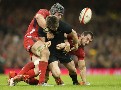 221114 -  Wales v New Zealand, Dove Men Series 2014, Cardiff - Beauden Barrett of New Zealand is tackle by Dan Lydiate of Wales and Sam Warburton of Wales   