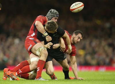 221114 -  Wales v New Zealand, Dove Men Series 2014, Cardiff - Beauden Barrett of New Zealand is tackle by Dan Lydiate of Wales and Sam Warburton of Wales   