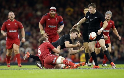 221114 -  Wales v New Zealand, Dove Men Series 2014, Cardiff - Beauden Barrett of New Zealand releases the ball as Alun Wyn Jones of Wales tackles