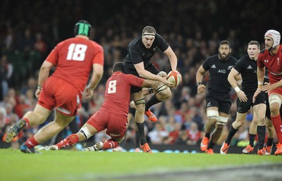 221114 - Wales v New Zealand -Brodie Retallick is tackled by Taulupe Faletau of Wales