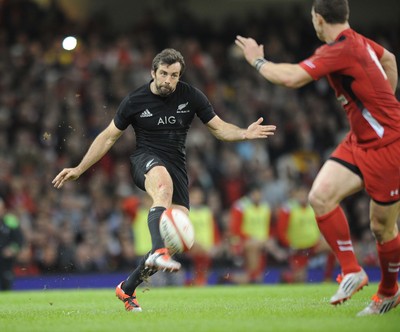 221114 - Wales v New Zealand -New Zealand's Conrad Smith kicks past George North