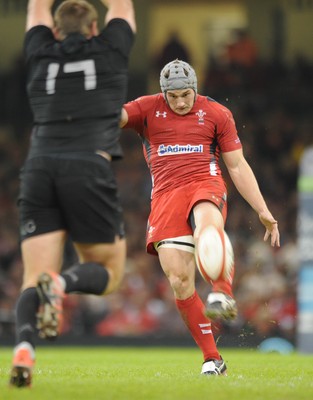 221114 - Wales v New Zealand -Wales Jonathan Davies kicks past Joe Moody