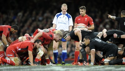 221114 - Wales v New Zealand - Dove Men+Care Series - The scrum packs down as referee Wayne Barnes and Rhys Webb of Wales look on