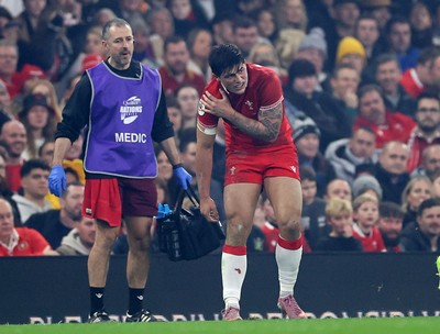 221125 - Wales v New Zealand All Blacks - Quilter Nations Series - Louis Rees-Zammit of Wales holds his shoulder 