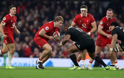 221125 - Wales v New Zealand All Blacks - Quilter Nations Series - Archie Griffin of Wales is challenged by Fletcher Newell of New Zealand 