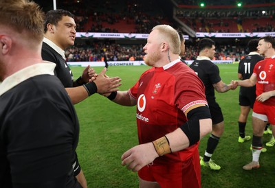 221125 - Wales v New Zealand All Blacks - Quilter Nations Series - Keiron Assiratti of Wales shakes hands with the opposition at full time