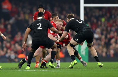 221125 - Wales v New Zealand All Blacks - Quilter Nations Series - Keiron Assiratti of Wales is tackled by Fabian Holland of New Zealand 