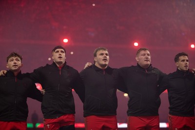 221125 - Wales v New Zealand All Blacks - Quilter Nations Series - Morgan Morse, Archie Griffin, Rhys Carre and Kieran Hardy of Wales during the anthem