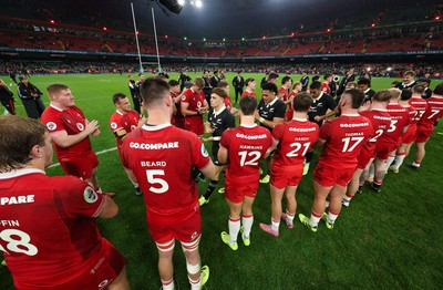 221125 - Wales v New Zealand, Quilter Nations Series - The Wales team applaud the New Zealand All Blacks off the pitch at the end of the match