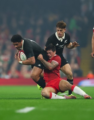 221125 - Wales v New Zealand, Quilter Nations Series - Caleb Clarke of New Zealand is tackled by Louis Rees-Zammit of Wales