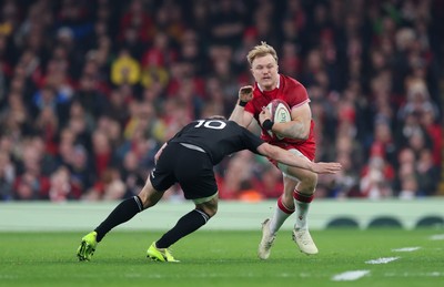 221125 - Wales v New Zealand, Quilter Nations Series -Blair Murray of Wales takes on Damian McKenzie of New Zealand  