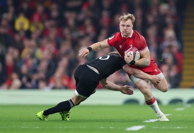 221125 - Wales v New Zealand, Quilter Nations Series -Blair Murray of Wales takes on Damian McKenzie of New Zealand  