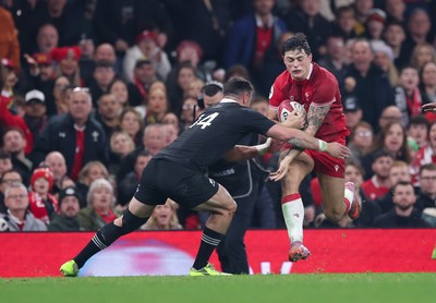 221125 - Wales v New Zealand, Quilter Nations Series - Louis Rees-Zammit of Wales takes on Will Jordan of New Zealand  