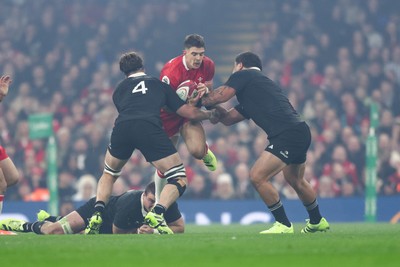 221125 - Wales v New Zealand - Quilter Nations Series - Joe Hawkins of Wales is tackled by Scott Barrett and Tamaiti Williams of New Zealand