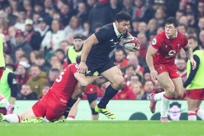 221125 - Wales v New Zealand - Quilter Nations Series - Anton Lienert-Brown of New Zealand is tackled by Max Llewellyn of Wales