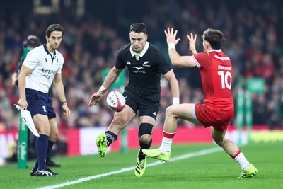221125 - Wales v New Zealand - Quilter Nations Series - Will Jordan of New Zealand chips the ball over Dan Edwards of Wales
