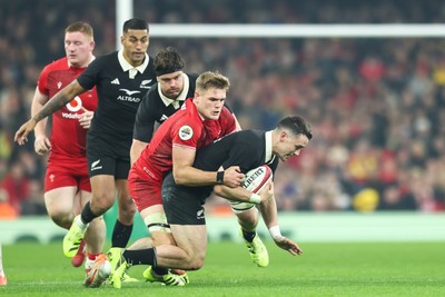 221125 - Wales v New Zealand - Quilter Nations Series - Will Jordan of New Zealand is tackled by Taine Plumtree of Wales