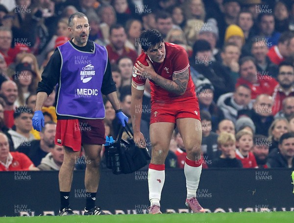 221125 - Wales v New Zealand All Blacks - Quilter Nations Series - Louis Rees-Zammit of Wales holds his shoulder 
